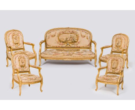 Full title: A French five-piece salon set comprising four gilt wood armchairs and a sofa with embroidered upholstery, Sormani