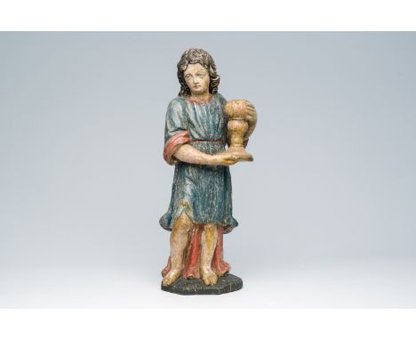 Full title: A Flemish carved and polychrome decorated figure of an angel with a candlestick in hand, 18th C.Description:H 62,
