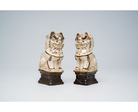 Full title: A pair of Chinese Cizhou glazed joss-stick holders modelled as Buddhist lions, MingDescription:H 16,5 cmCondition