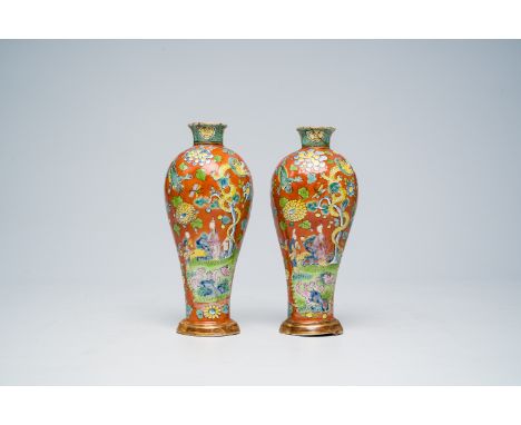 Full title: A pair of clobbered Chinese famille rose vases with figures in a garden surrounded by frogs and dragons, Yongzhen