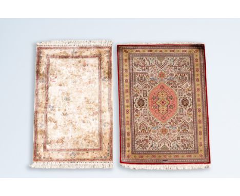 Full title: Two Persian silk rugs with floral design and a hunting scene, Iran, 20th C.Description:151 x 107 cm 150 x 94 cmCo