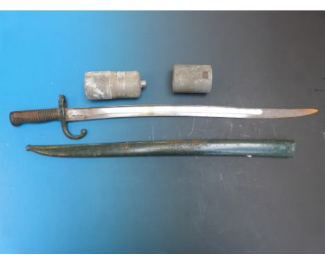 A French bayonet in scabbard together with a water bottle