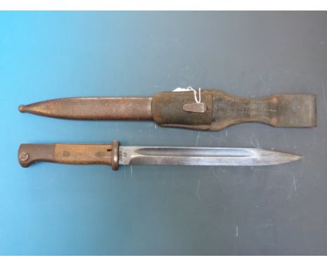 A German bayonet in scabbard, probably WWII, stamped 3193, JJ AND 43 asw