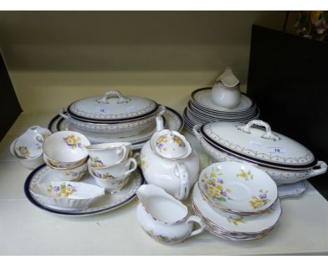 A Royal Albert 24-piece tea set including teapot in "Floral" design, together with an Alfred Meakin 23-piece dinner service i