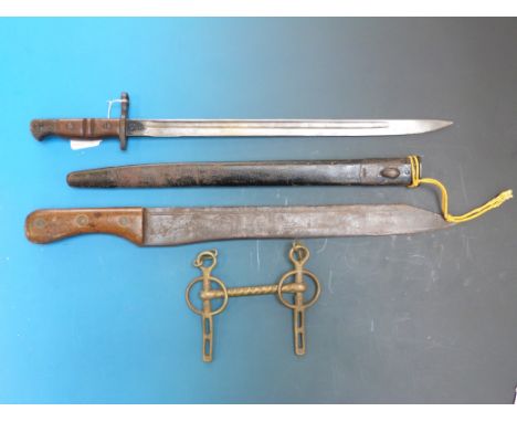 A WWI Remington bayonet dated 1913 and a machete