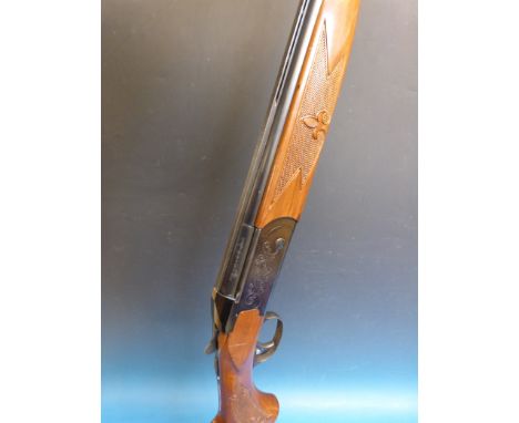 A Valmet 12 bore over and under double barrelled ejector shotgun, 28 inch barrels serial number 104908.  PLEASE NOTE THAT A V