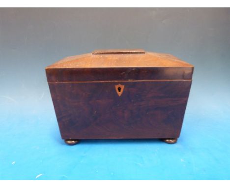 Mahogany sarcophagus-shaped tea caddy with satinwood inlay to lock and turned ivory handles, raised on bun feet