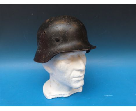 A German WW2 era helmet with leather lining