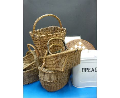 A collection of enamel kitchen ware and baskets 