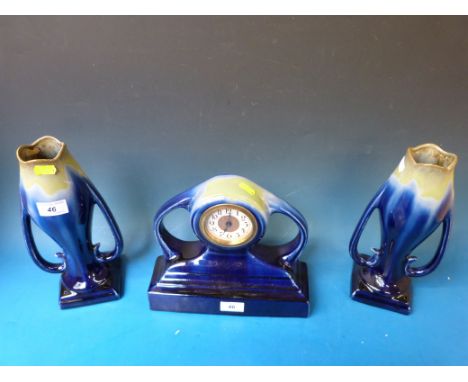 A French ceramic Art Nouveau clock garniture, c1900