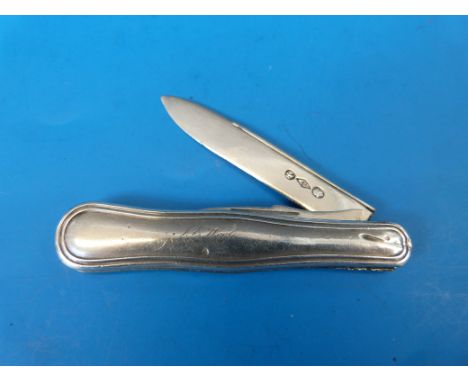 A white metal folding fruit knife with fold out blade and pick, the body with shaped edge and engraved J E Wool Feb 29th, bel