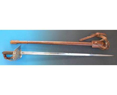 A Victorian Henry Wilkinson 1897 pattern Queen's Royal Regiment officer's sword in leather scabbard with Wilkinson patent sol