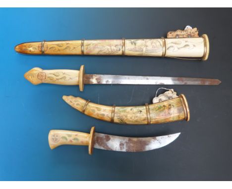 Two Eastern bone swords with erotic scenes to the sheaths and handles
