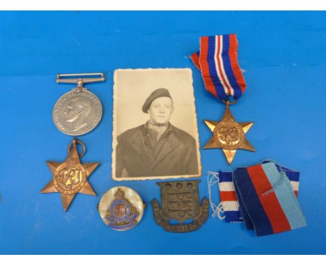 A group of three WWII medals in original box together with an Army Ordinance Corps plaque and sweetheart brooch 