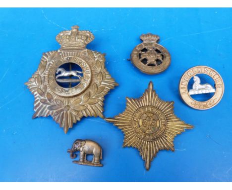 A collection of Victorian badges including home service helmet plate to the West Yorkshire regiment, Derbyshire Glengarry bad