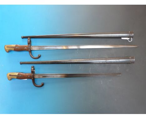 Pair of French late 19th bayonets both marked to blade M're d'armes de St Etienne one May 1878 the other April 1879, both wit