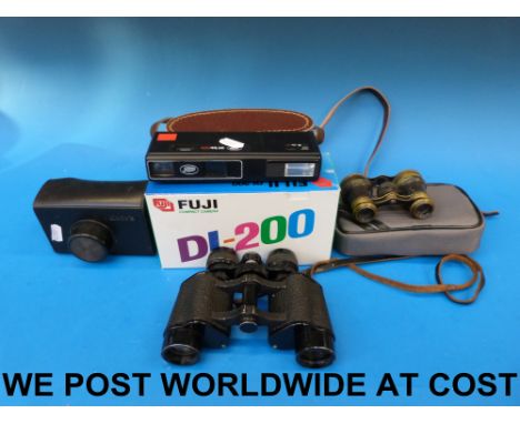 A pair of Lieberman & Gortz binoculars, a Fuji DL-200 camera, a Kodak camera etc