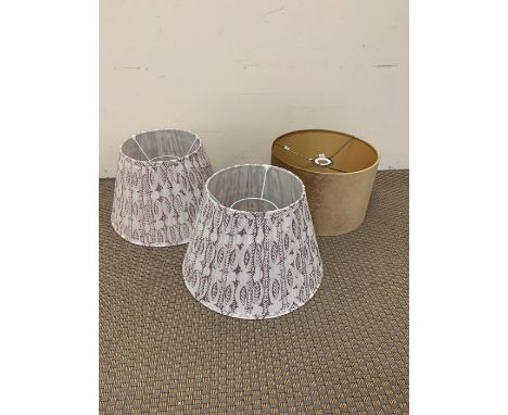 Pair of cotton fabric lampshades and a gold velvet lamp shade 
