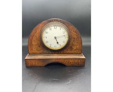A French walnut inlaid mantel clock 