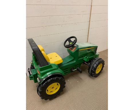 A children's John Deer tractor (missing the front loader)