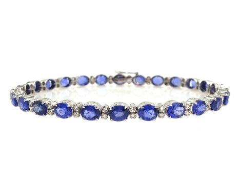 18ct white gold oval sapphire and round brilliant cut diamond bracelet, stamped 750, total sapphire weight approx 12.00 carat