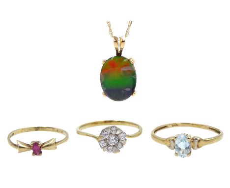 Gold blue topaz ring, gold cubic zirconia cluster ring and a single stone ruby ring, all 9ct stamped or hallmarked and a gold
