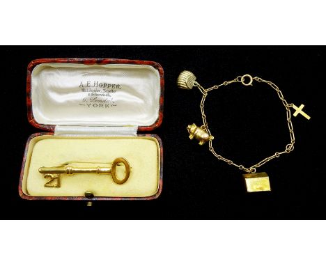 9ct gold 21 key brooch, Chester 1951, retailed by A.E. Hopper York, boxed and a gold bracelet with gold pig, bag and dog hous