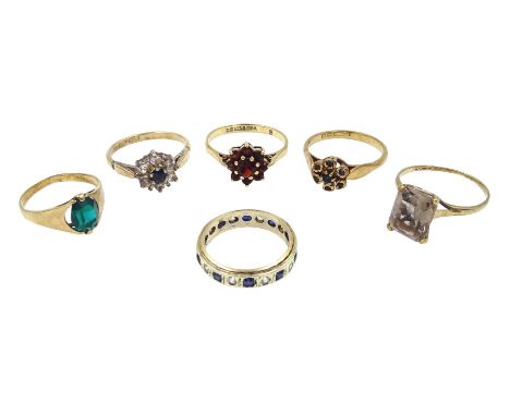 Gold sapphire cluster ring, garnet cluster ring and three other stone set rings, all 9ct hallmarked or stamped and one other 