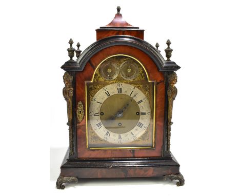 A 19th century tortoiseshell cased bracket clock with chiming movement, the brass face with three silvered dials, the central