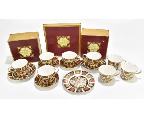 ROYAL CROWN DERBY; fourteen pieces of assorted ceramics decorated in the 1128 pattern, including a boxed trio, a boxed teacup