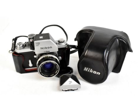 NIKON; a model F camera S/N 6926233 with Nikkor-H Auto 1:2 f=50mm lens No. 791561, cased with a spare viewing head.Additional