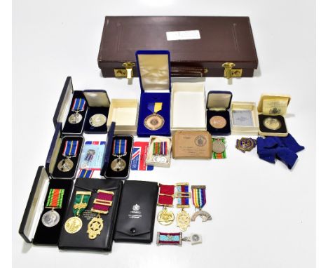 Two World War II Defence Medals, a set of miniatures, further medals to include three cased National Service Medals, The Rota