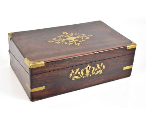 A Victorian rosewood brass bound and inlaid writing slope, the fitted interior with black velvet writing surface and pen tray