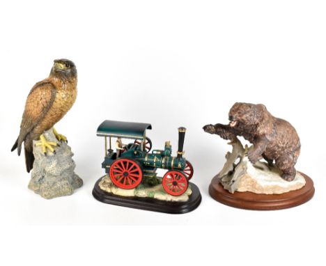 THE LEONARDO COLLECTION; a resin model of a steam engine, raised on naturalistic plinth base,&nbsp;length 24cm, a similar mod