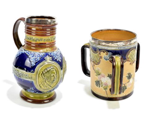 DOULTON LAMBETH; an Artware tyg with hallmarked silver collar, height 15cm, together with a Doulton Lambeth jug commemorating