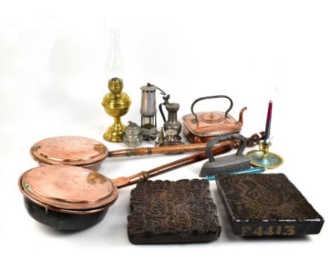 A mixed group of metalware, including two copper warming pans with turned wooden handles, miners' safety lamp, brass based oi