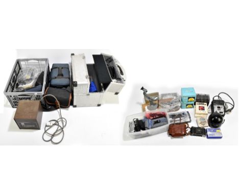 A large collection of assorted camera equipment, including various timing and focusing aids, a Kodak camera, modern cameras i