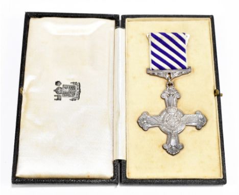 A WWII RAF Distinguished Flying Cross, stamped 1945 to reverse, on original suspension and ribbon in Royal Mint fitted case g