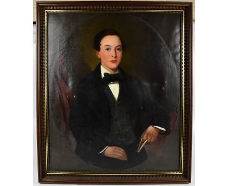 A 19th century oil on canvas, portrait of a gentleman holding a book, apparently unsigned, 84 x 70cm, framed.Additional Infor