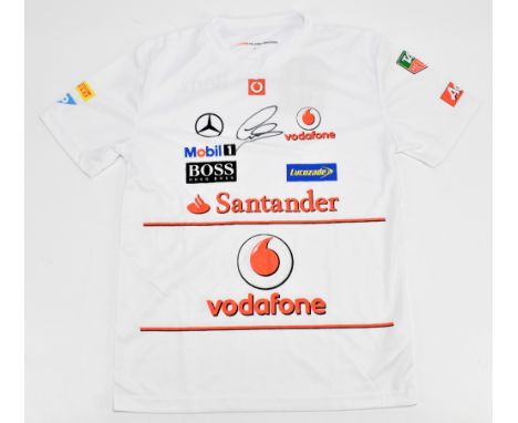 LEWIS HAMILTON; a signed McLaren Mercedes Vodafone shirt with printed logos and attached label, size S.Additional Information