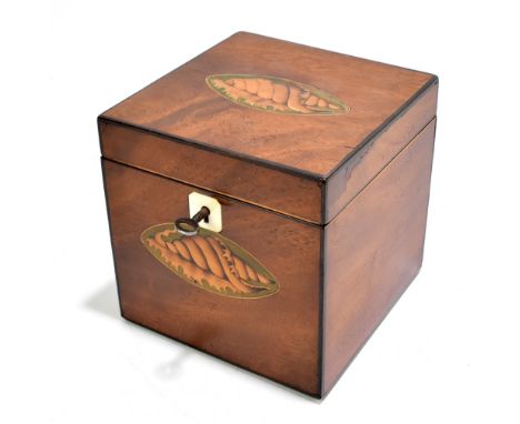 A Georgian inlaid&nbsp;mahogany tea caddy of square form, the hinged cover&nbsp;enclosing compartment and cover, with ivory e