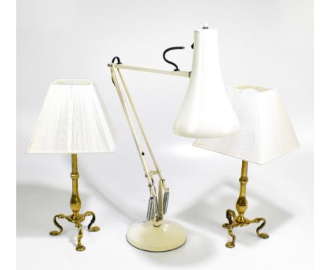 A pair of brass lamps from a Pullman carriage, raised on three scrolling supports, height including shade and fitment 42cm, a