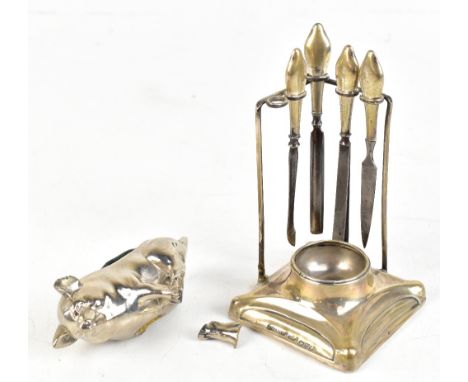 JOSEPH AND RICHARD GRIFFITHS; a George V hallmarked silver mounted manicure stand, Chester 1925, height 10cm, four silver han