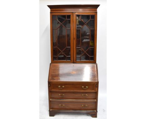 An&nbsp;Edwardian inlaid&nbsp;mahogany bureau bookcase, the twin astragal glazed doors&nbsp;enclosing three adjustable shelve