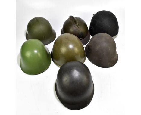 Seven military and public service helmets comprising Czechoslovakian Army MVZ, Yugoslavian Army M59/85, Austrian MK58, Swedis