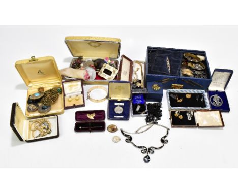 A quantity of assorted costume jewellery including gold plated snap bangle, two mourning bracelets, assorted brooches, etc.Ad