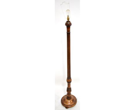 A 20th century beech standard lamp with fluted column,&nbsp;height 154cm.Additional InformationThere is a crack to the termin