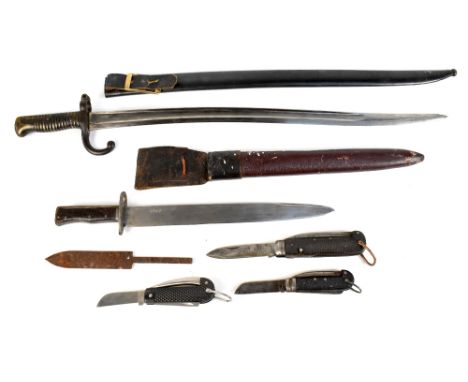 A 19th century French Chassepot-type bayonet, the blade back signed and dated 1879, with matching metal scabbard, both stampe