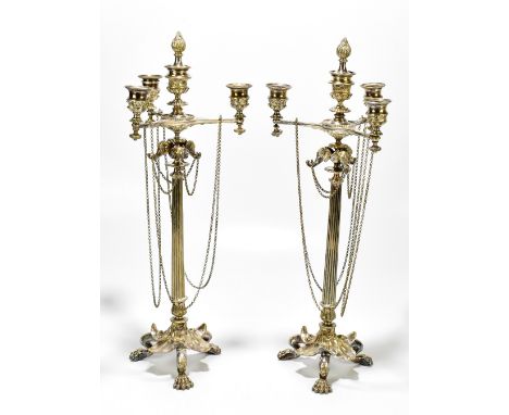 A pair of modern silver plated four light candelabra with central detachable flaming torch finial above elephant masks with r