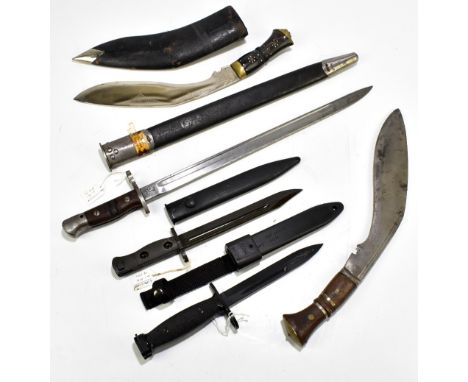 A US 1917 Remington bayonet with scabbard, an Australian L182 c1950s bayonet, both with scabbards, a further later bayonet an